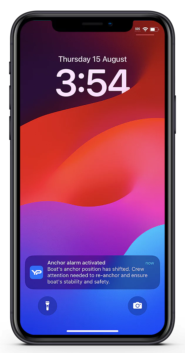 iPhone lock screen with the YachtPilot anchor alarm push notification displayed