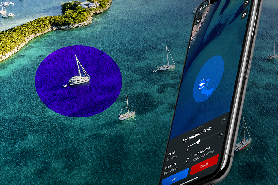 aerial shot of a vessel anchored in a bay encircled by a blue marine geofence boundary, a mobile device with a satellite image in real time of the vessel's position with the option to set an anchor alarm remotely.